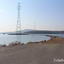 Tokarevsky lighthouse in Vladivostok, Rocky spit and power lines on the island of Russky